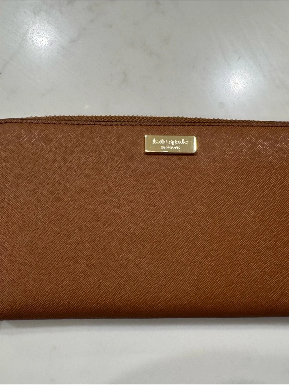 kate spade saffiano zip-around wallet in cognac brown with gold plaque